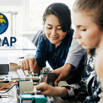 2 students working on a circuit board
