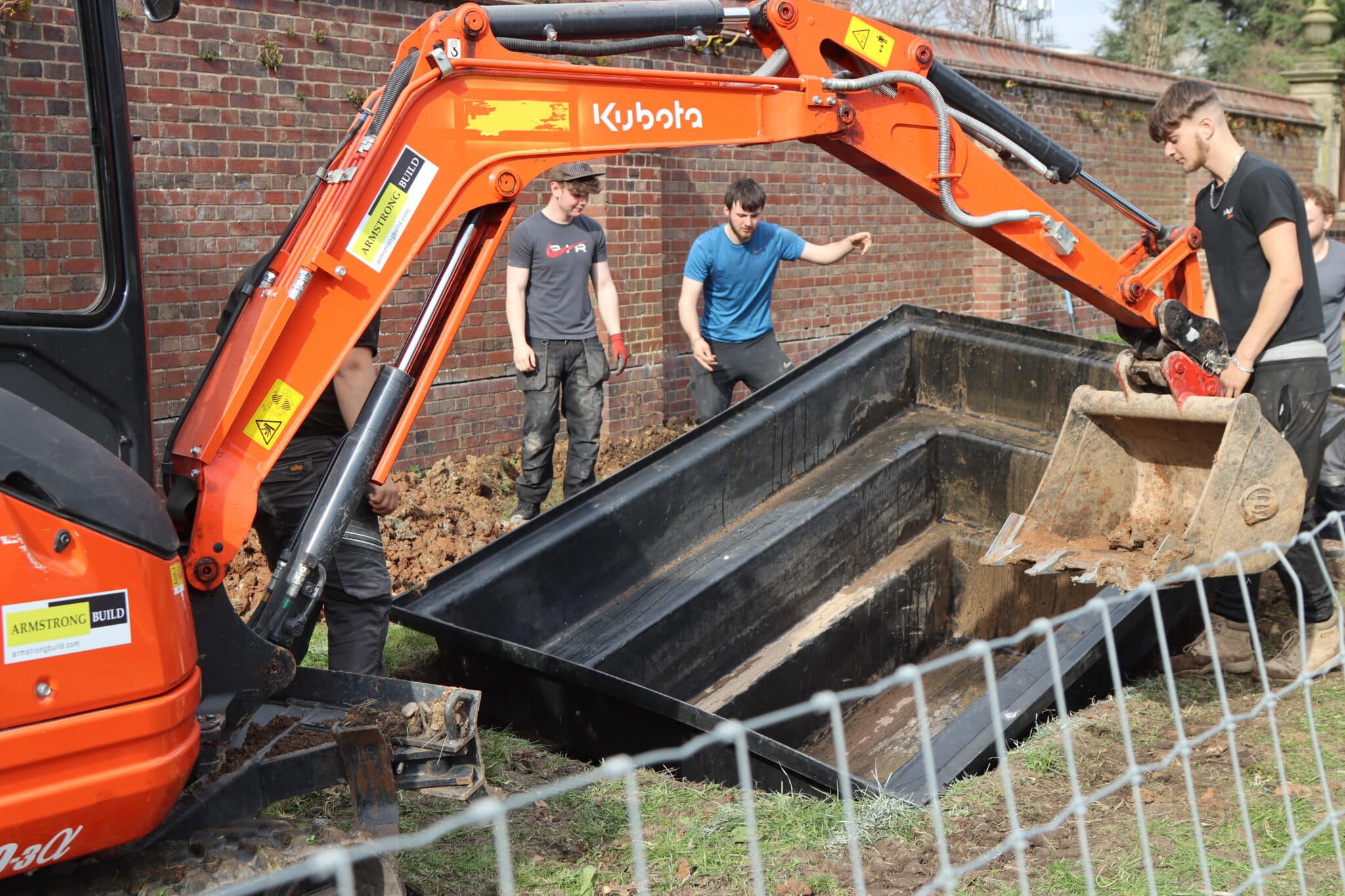 construction bricklaying students digging