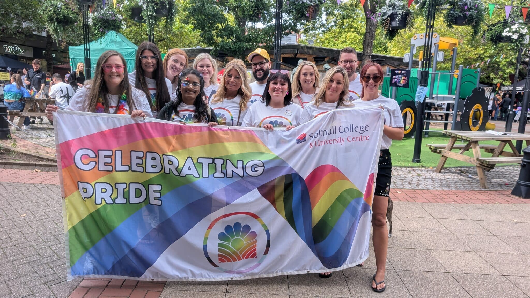 Staff with the Pride banner