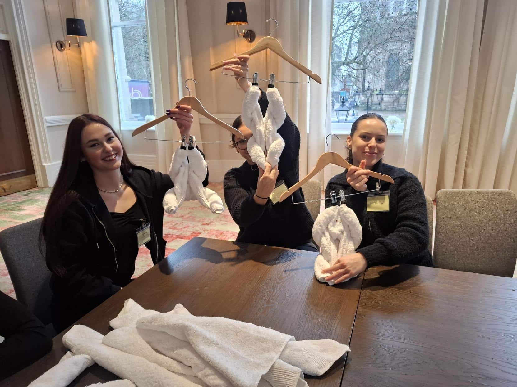 students learning how to make shapes out of towels
