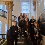 students at the staircase at the Grand Hotel in Birmingham
