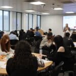students in a classroom with a presentation