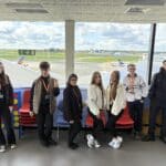 group shot of students at the airport