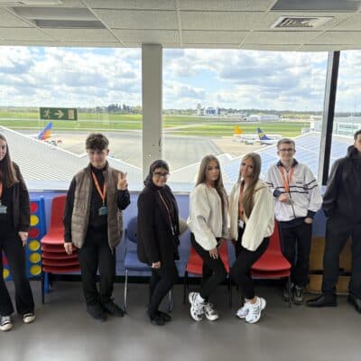 group shot of students at the airport
