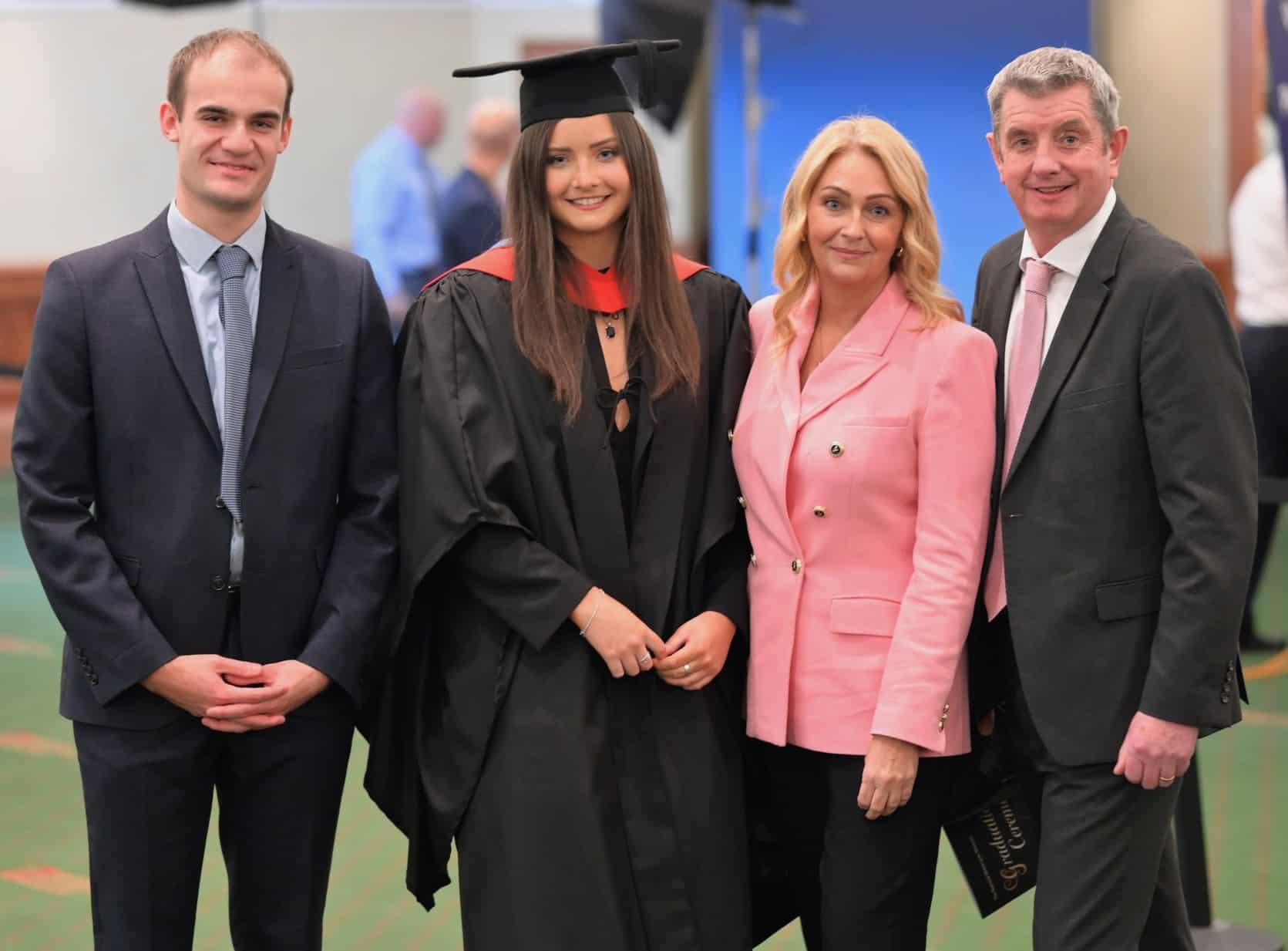 mia with her family at graduation