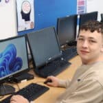 harvey morse sitting at a computer