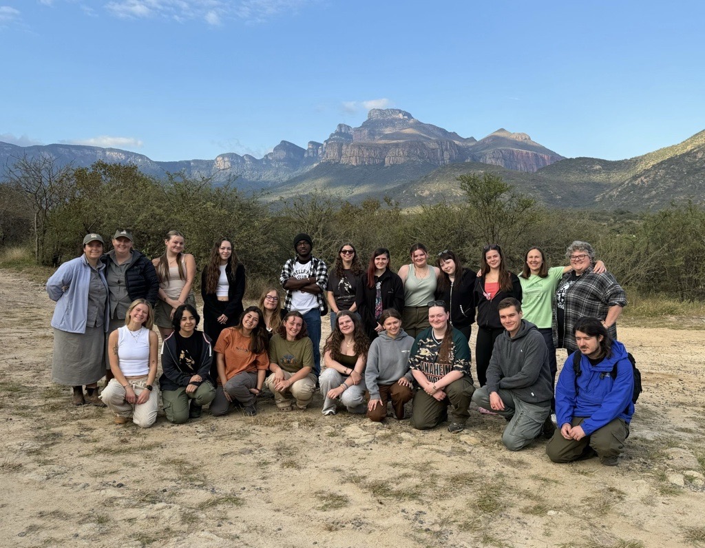 students in south africa with mountains behind them