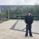 Rhys outside Rolls Royce