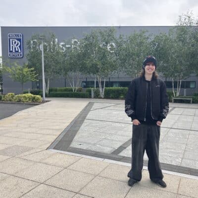 Rhys outside Rolls Royce