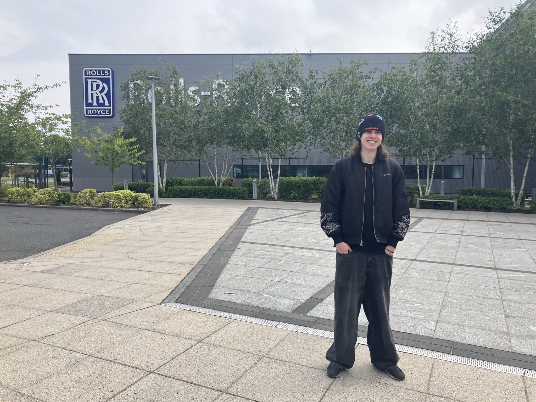 Rhys outside Rolls Royce